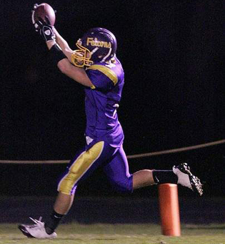 Eric Kluz scores a touchdown against Plymouth. (Courtesy Sheboygan Press) (10/17)