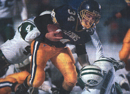 Matt Kimmler brushes off a tackle attempt in Falls' 41-0 state victory